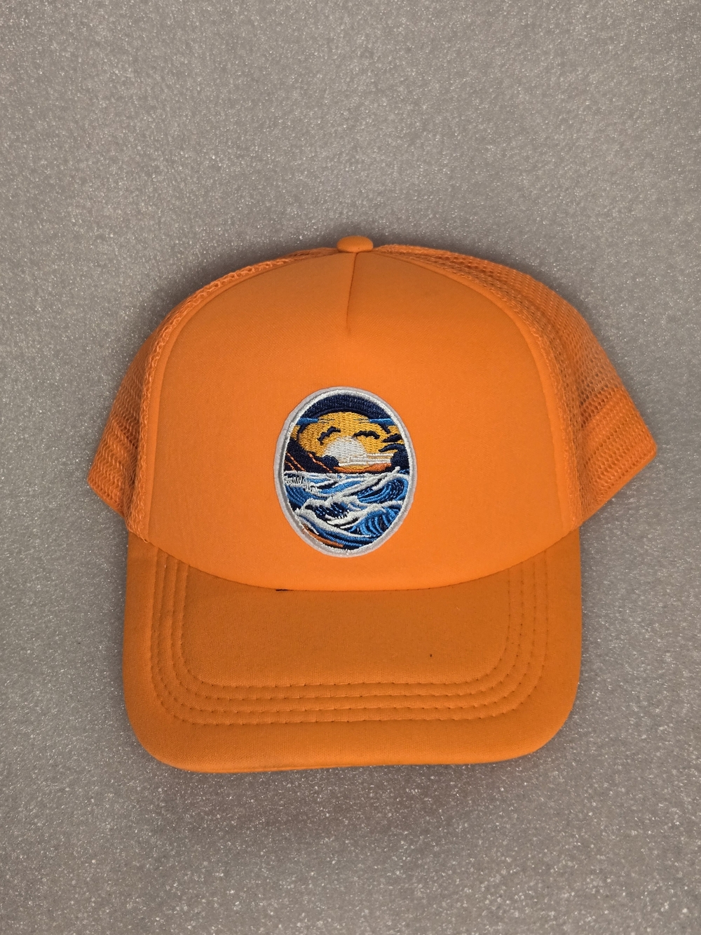 Men's Orange Trucker Cap with Ocean Wave Patch